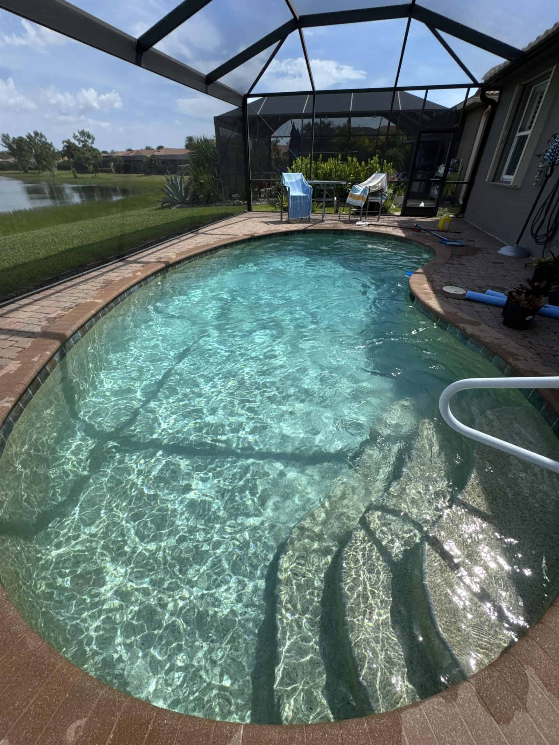 Bright turquoise residential swimming pool with clear water
