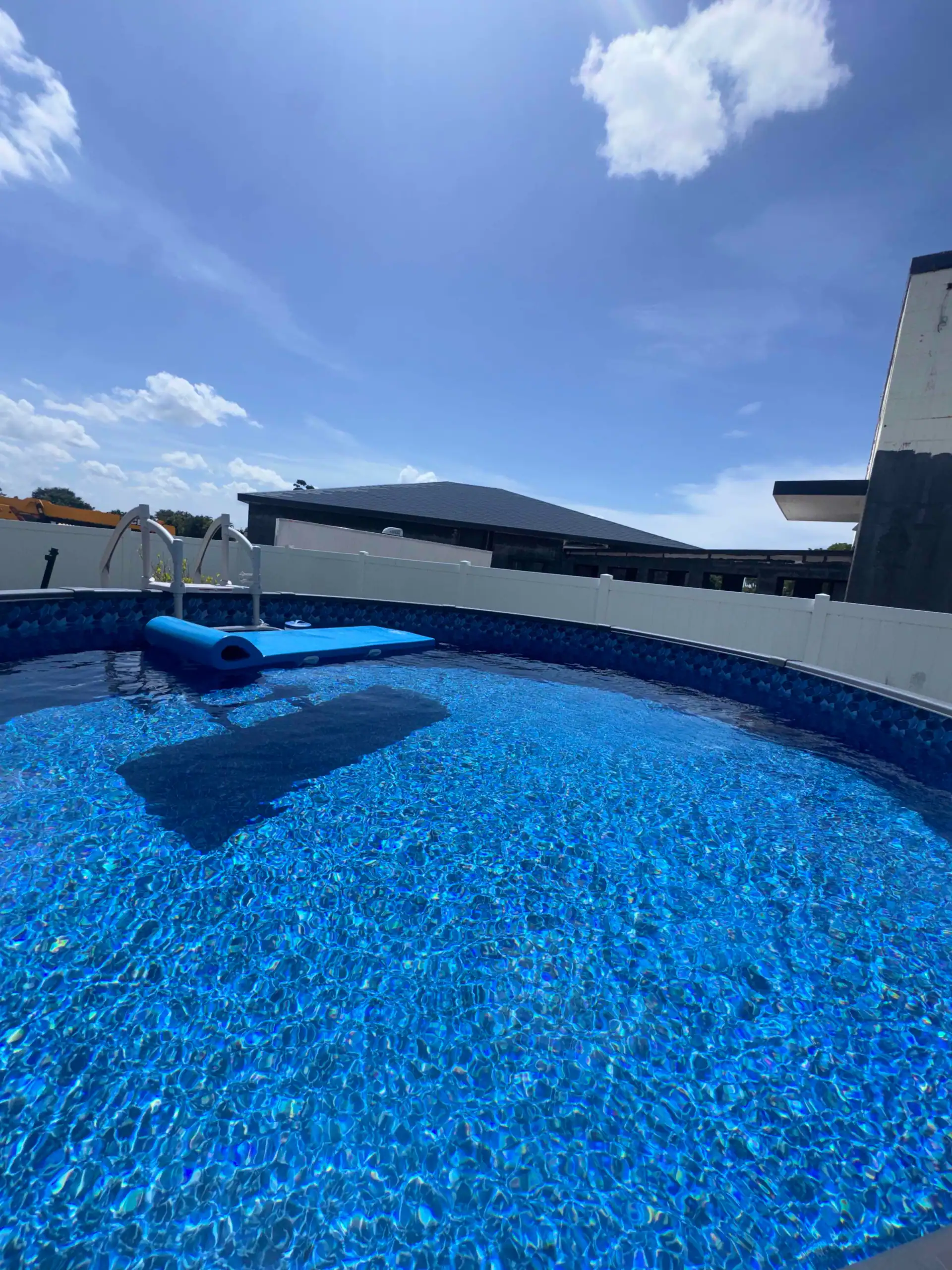 Beautiful blue residential swimming pool maintained by Pool Armor Pros
