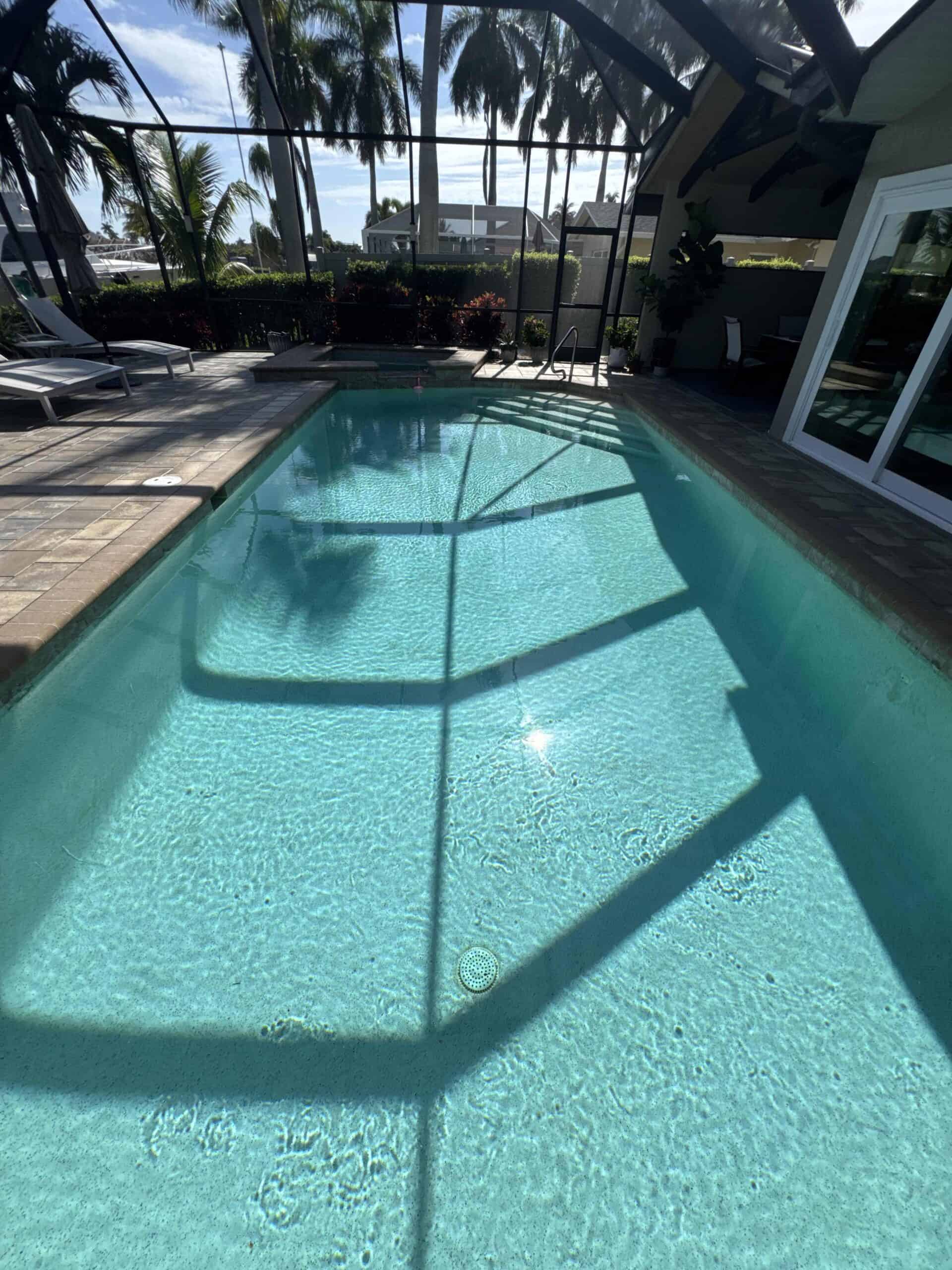 Screened residential pool with clear balanced water