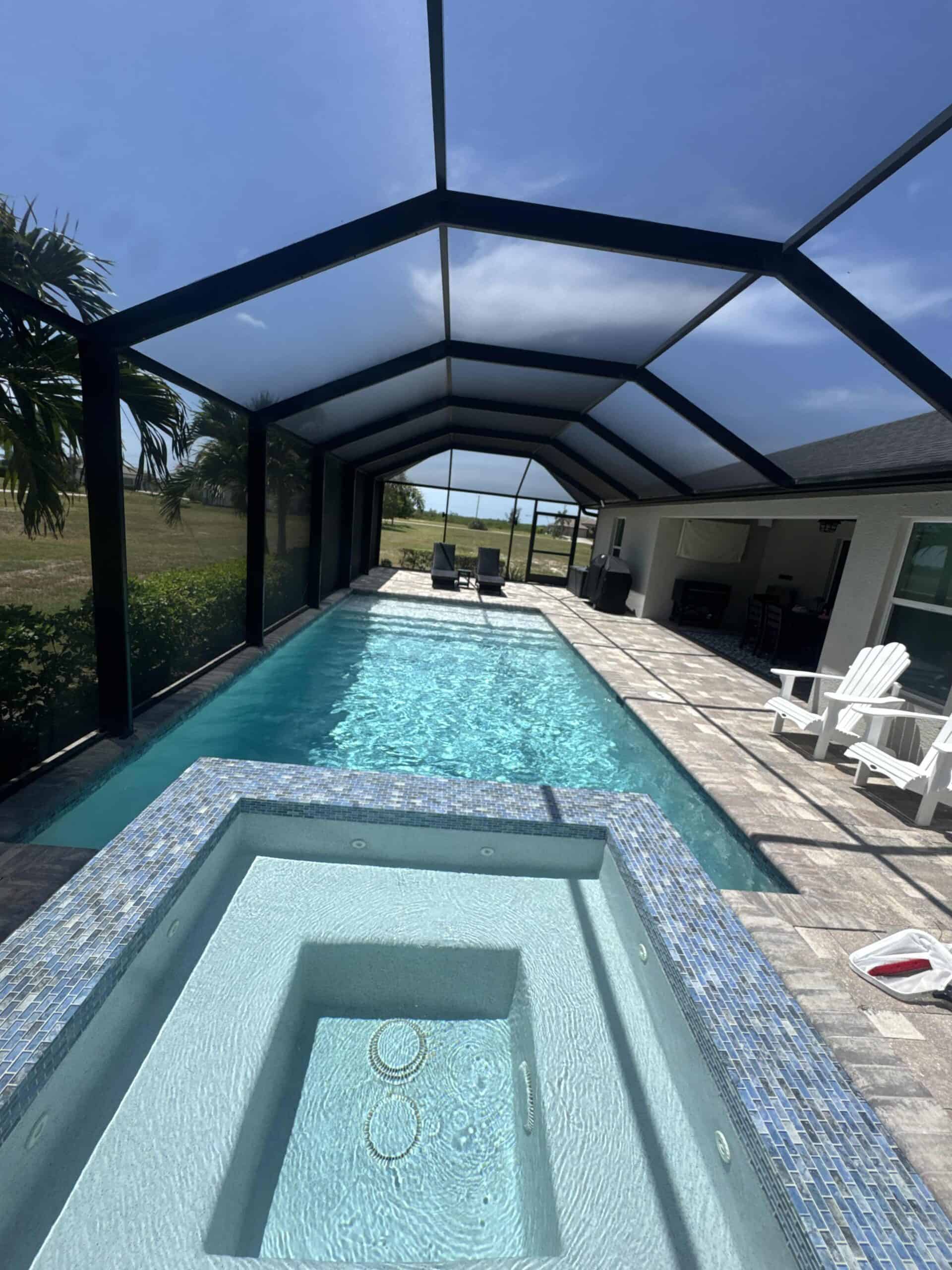 Clean swimming pool under Southwest Florida screened lanai