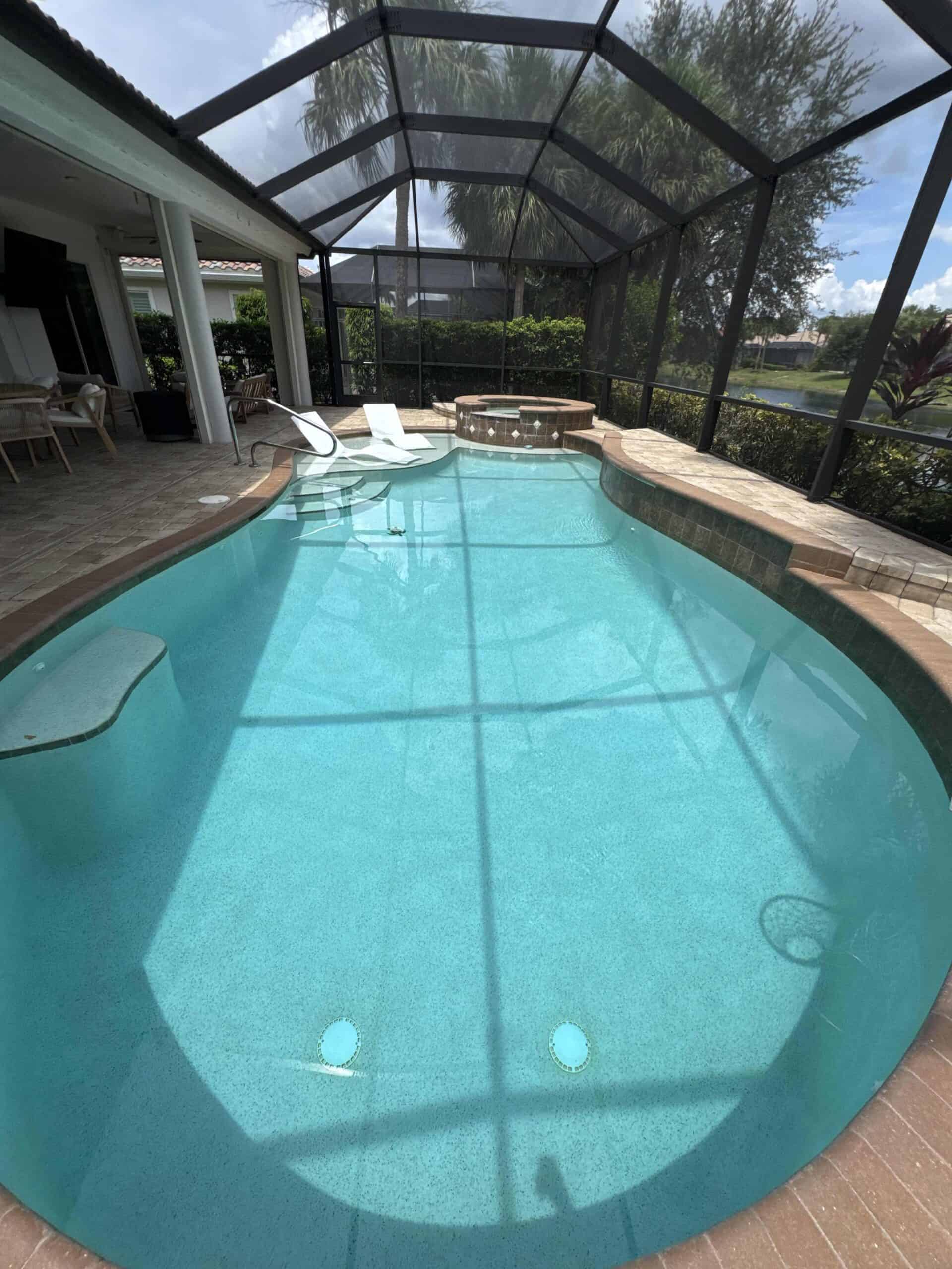 Professionally maintained turquoise residential swimming pool