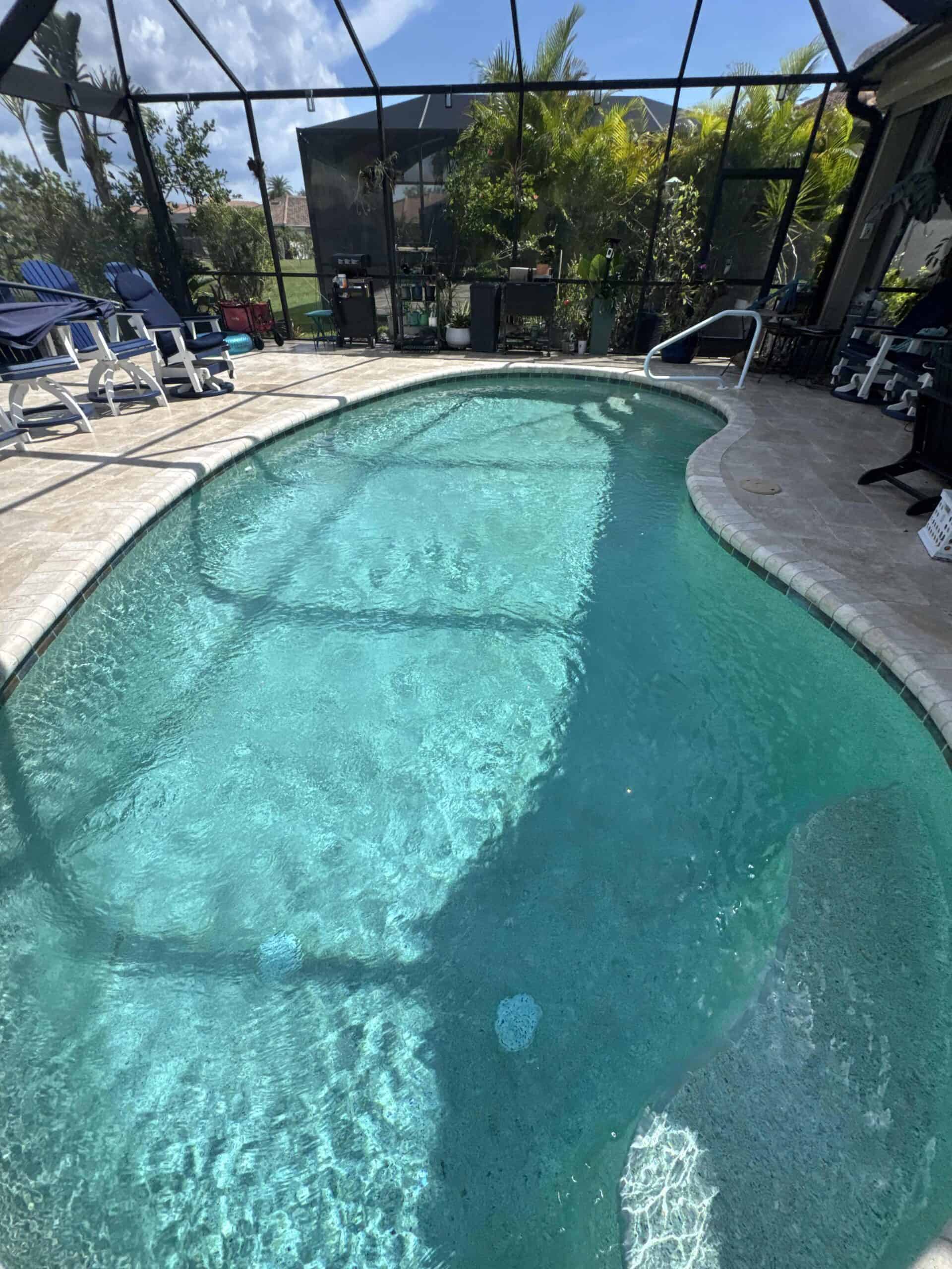 Clear blue residential pool maintained through weekly service
