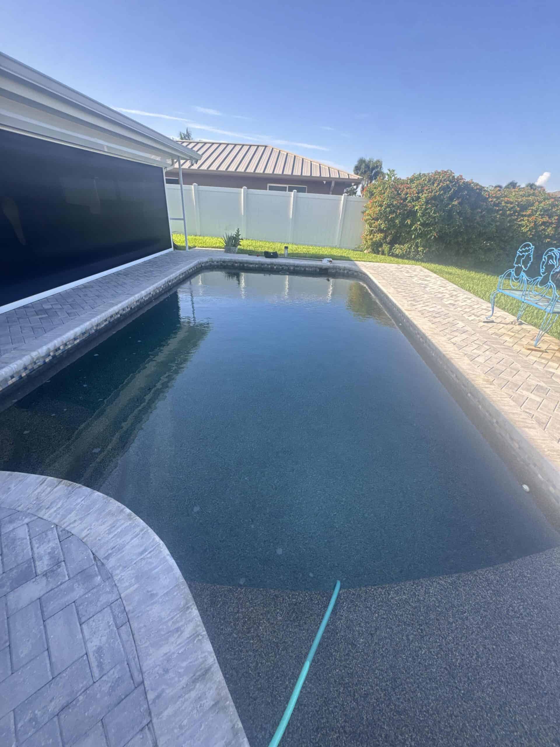 Long clean residential swimming pool maintained by Pool Armor Pros