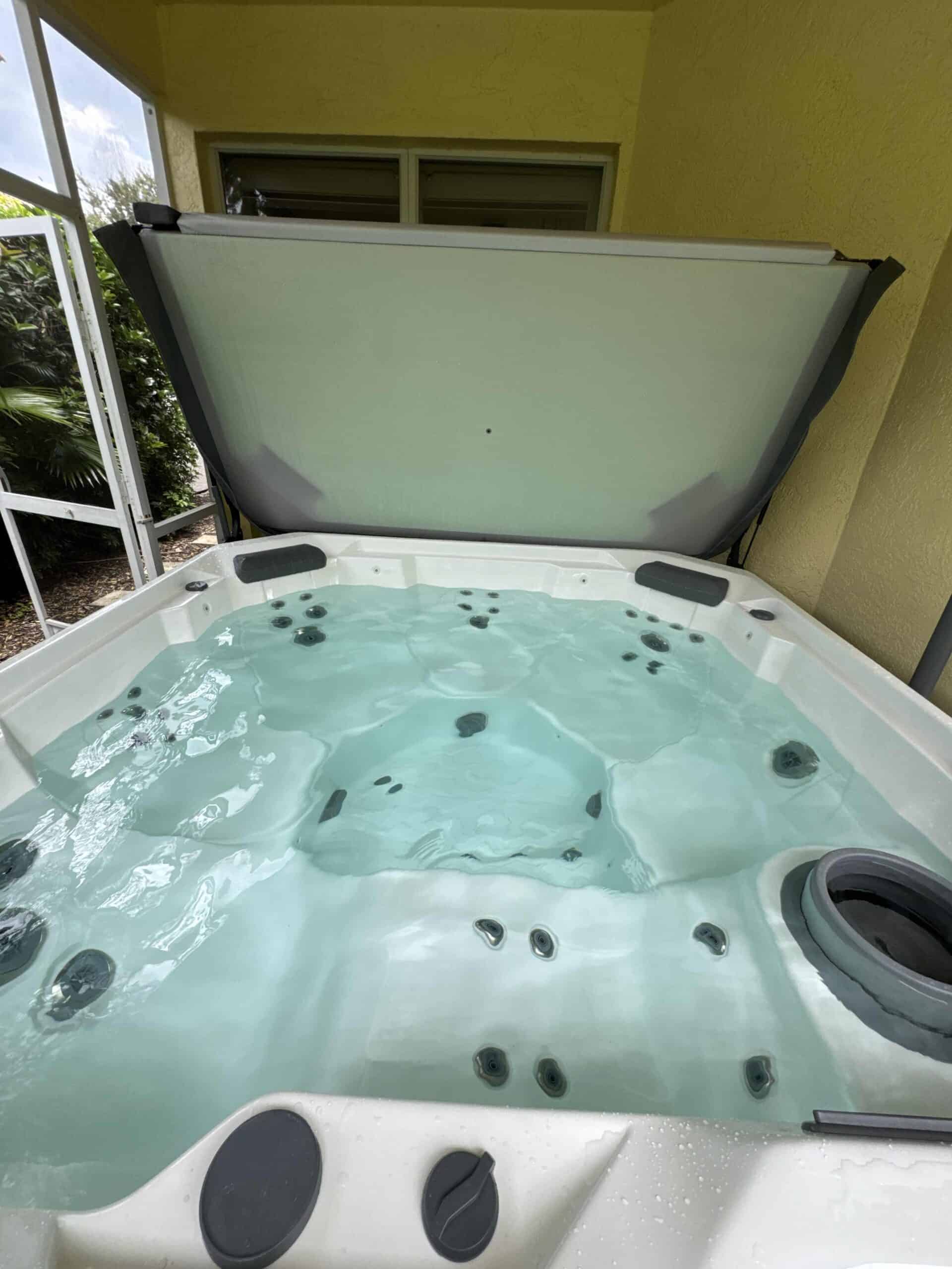 Open spa with clear, balanced water after detailing